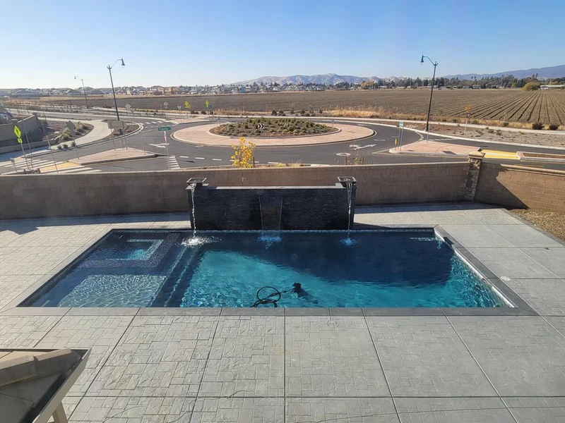 Geometric pool with spillway water features