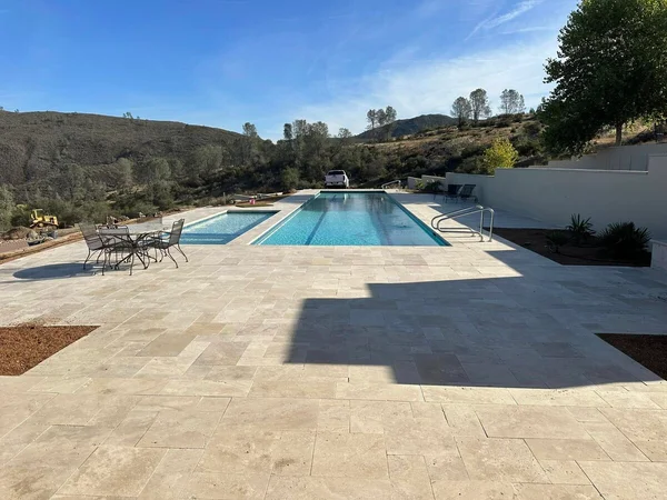 Travertine Patio Pool by Infinity E. Pools in Northern California